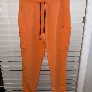 Figs women's Yola Skinny pants  in Vibrant Orange